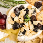 Baked brie with honey, almonds, cherries, and rosemary.