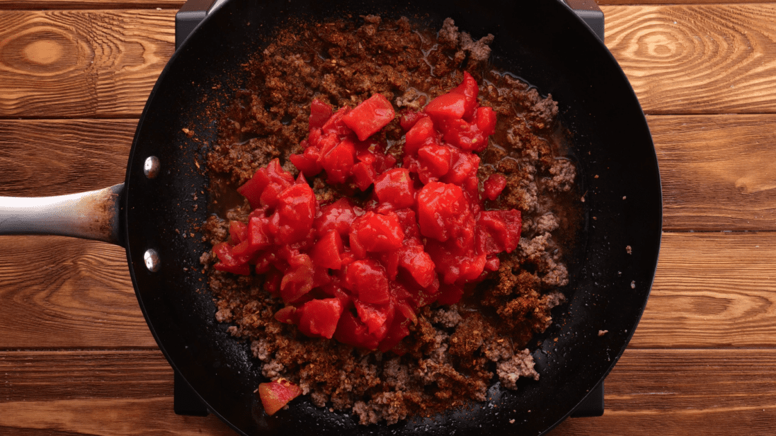 Add tomatoes to skillet.