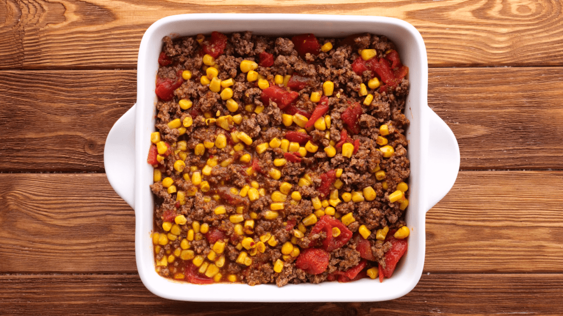 Add meat filling to greased baking dish.