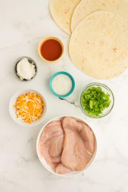 Ingredients for buffalo chicken quesadillas.