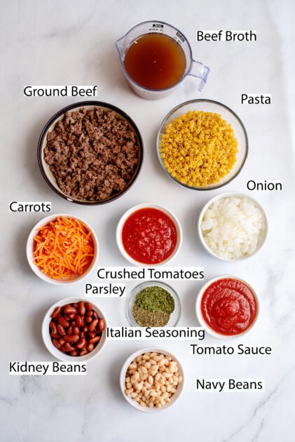 Labeled ingredients for slow cooker Pasta Fagioli.