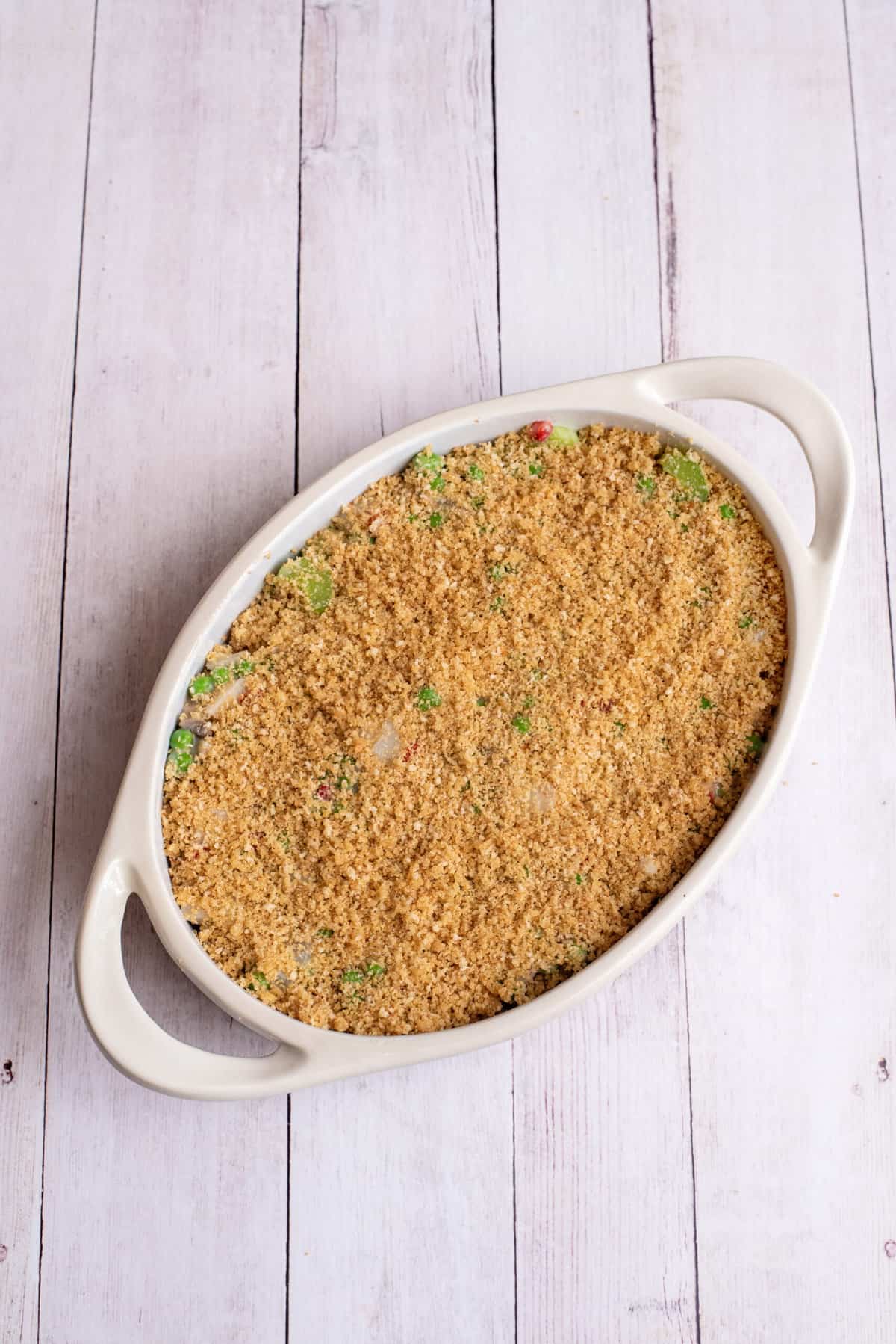 sprinkle bread crumb mixture over green pea casserole