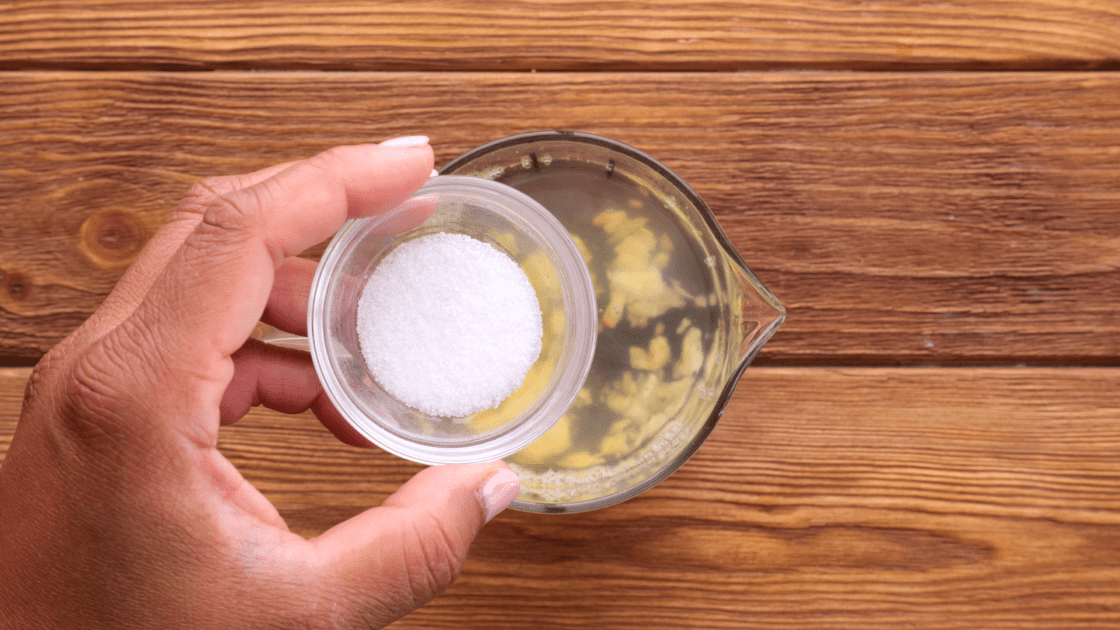 Add salt to measuring cup.