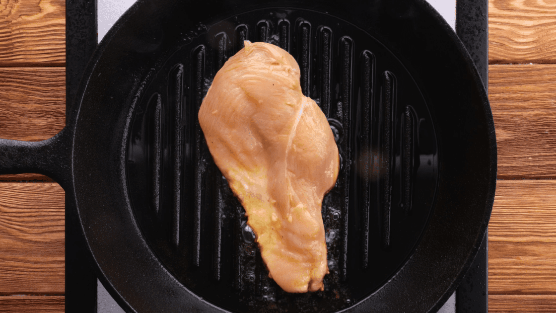 Grill marinated chicken breasts.