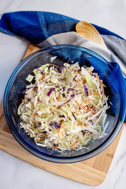 Add coleslaw mix to mixing bowl.
