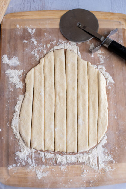 Cut the dough lengthwise into 8 strips.