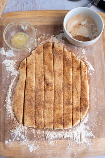 Sprinkle dough with half of the cinnamon sugar.