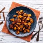 Plate of honey roasted sweet potato with cinnamon.