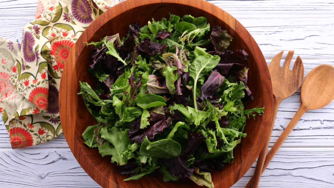 Add fresh greens to salad bowl.