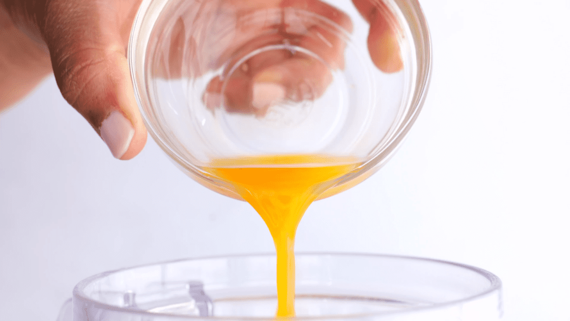 Add orange juice to blender.