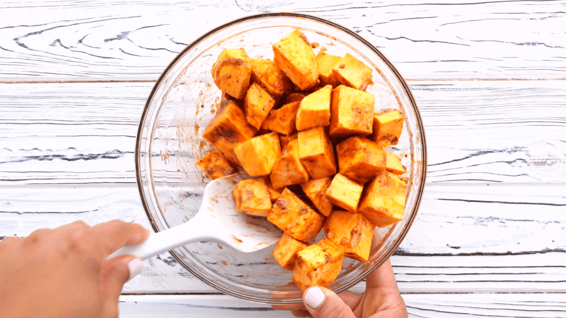 Toss to combine honey mix with sweet potato.