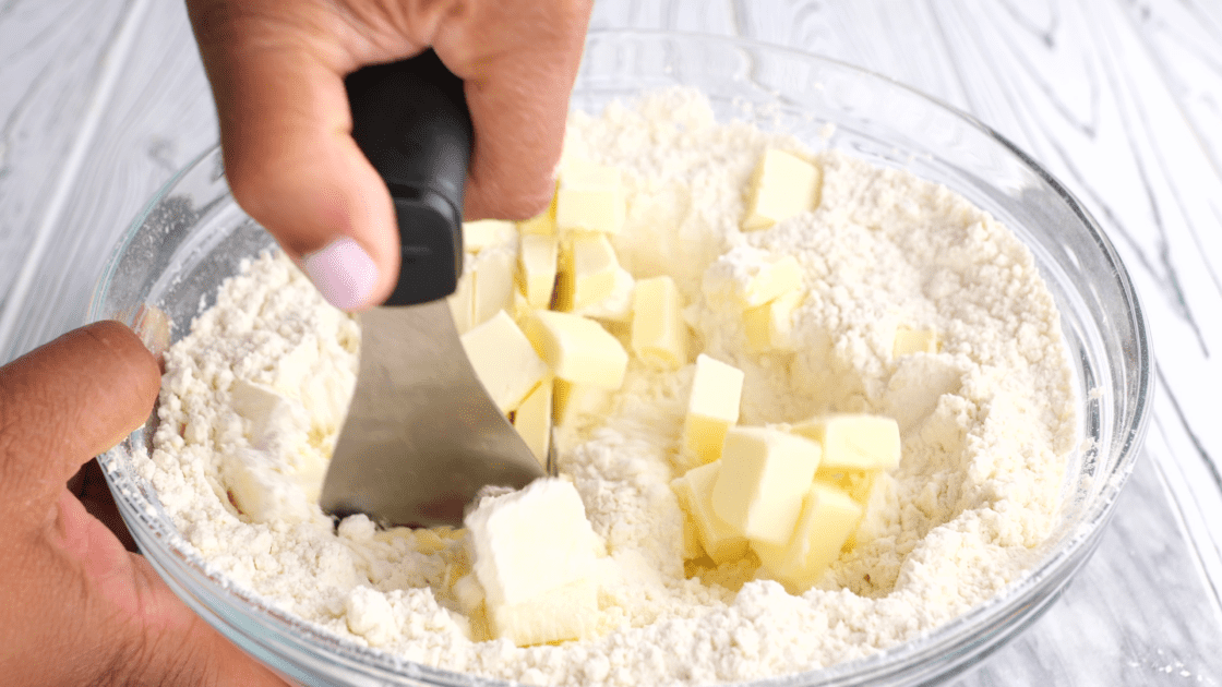 Cut butter into dry ingredients until crumbly.