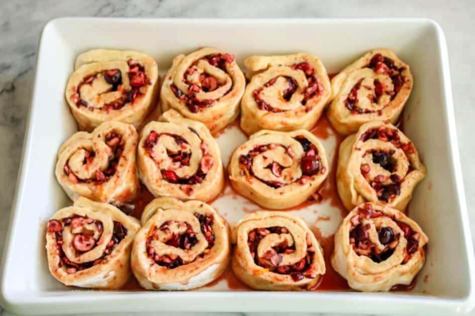 Place rolled and cut cranberry orange rolls in baking dish.