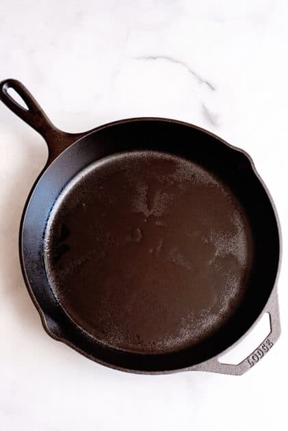 Heat oil in cast iron skillet.