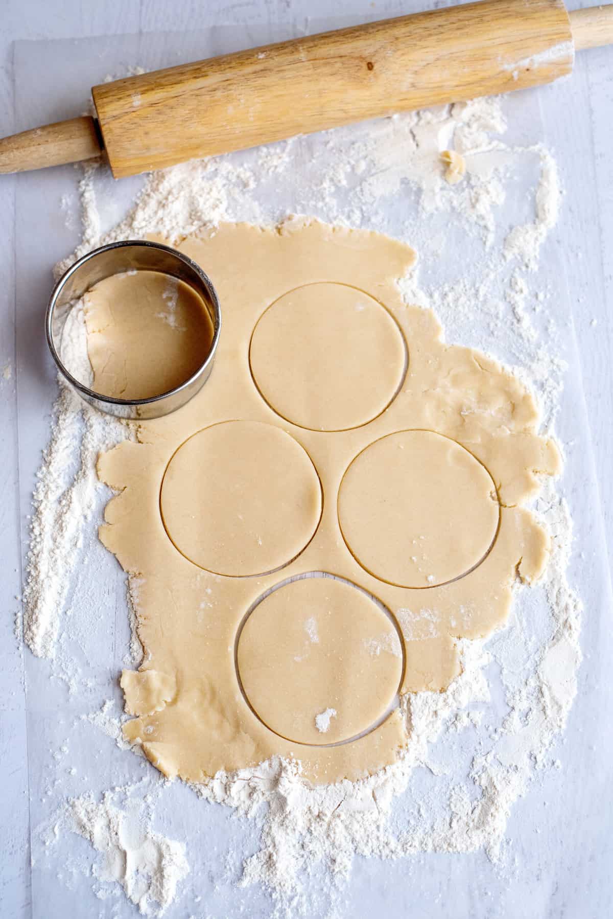 cut out shapes out of dough for Christmas cut out cookies