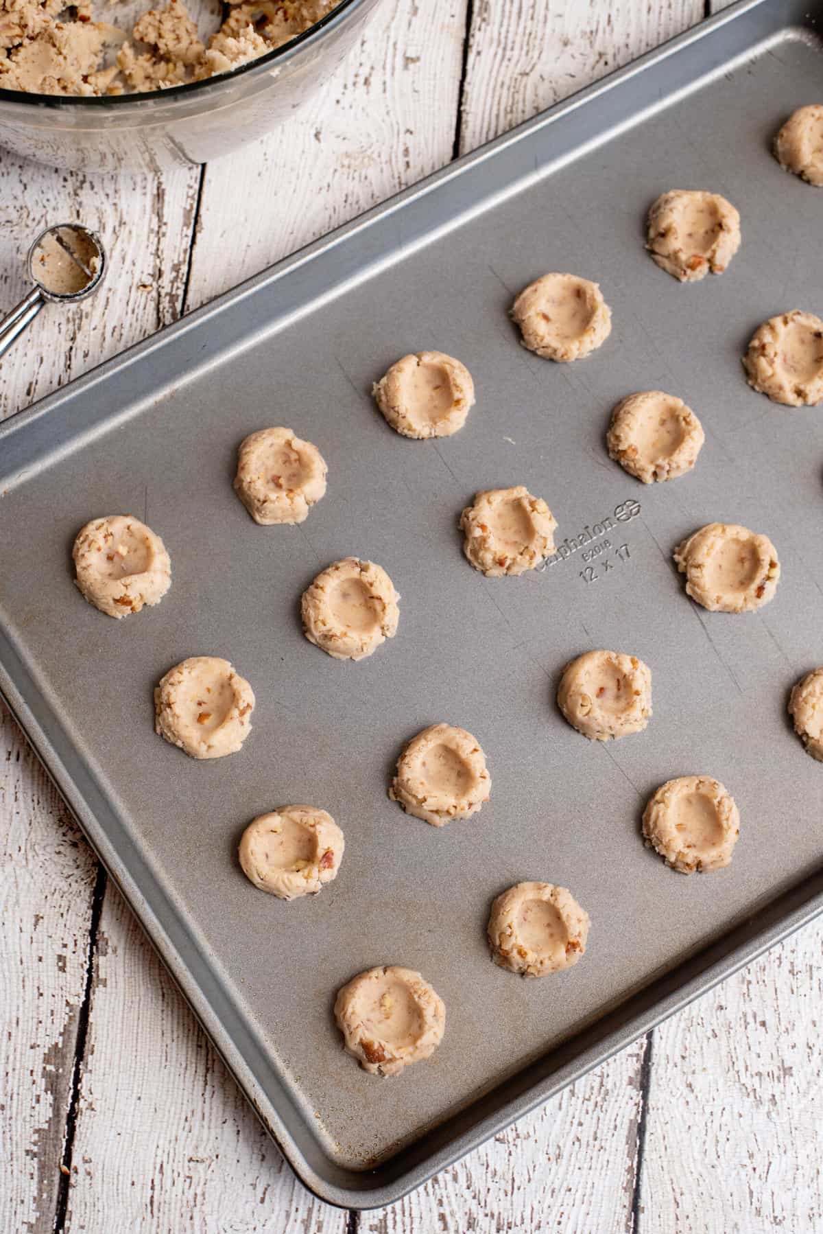 pecan thumbprint cookies ready to go in the oven