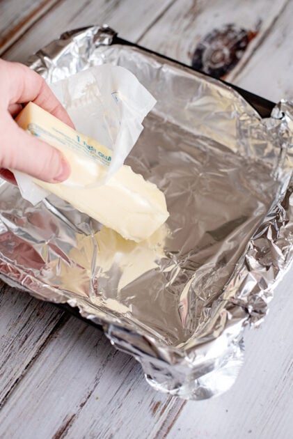 Grease foil with a stick of butter.