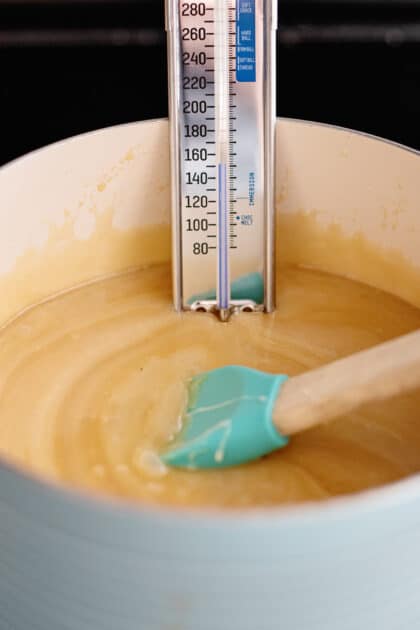 Place candy thermometer in pot.