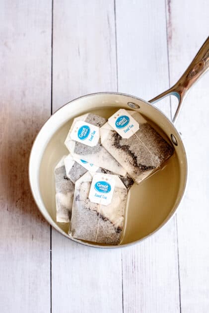 Tea bags in a pot with water.