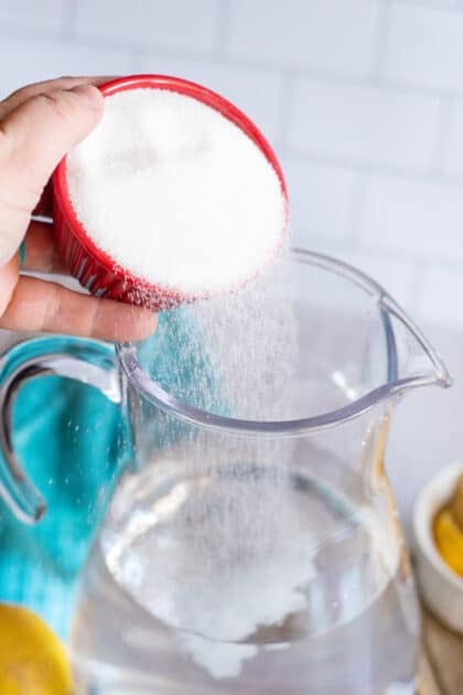 Adding sugar to cold water for sweet tea.