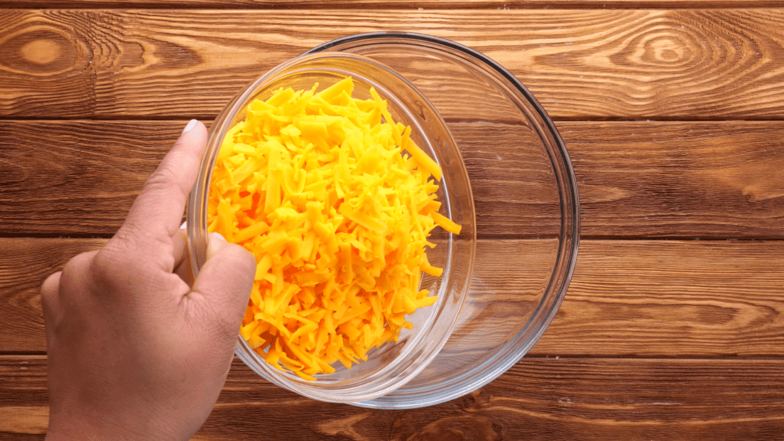 Add cheese to mixing bowl.