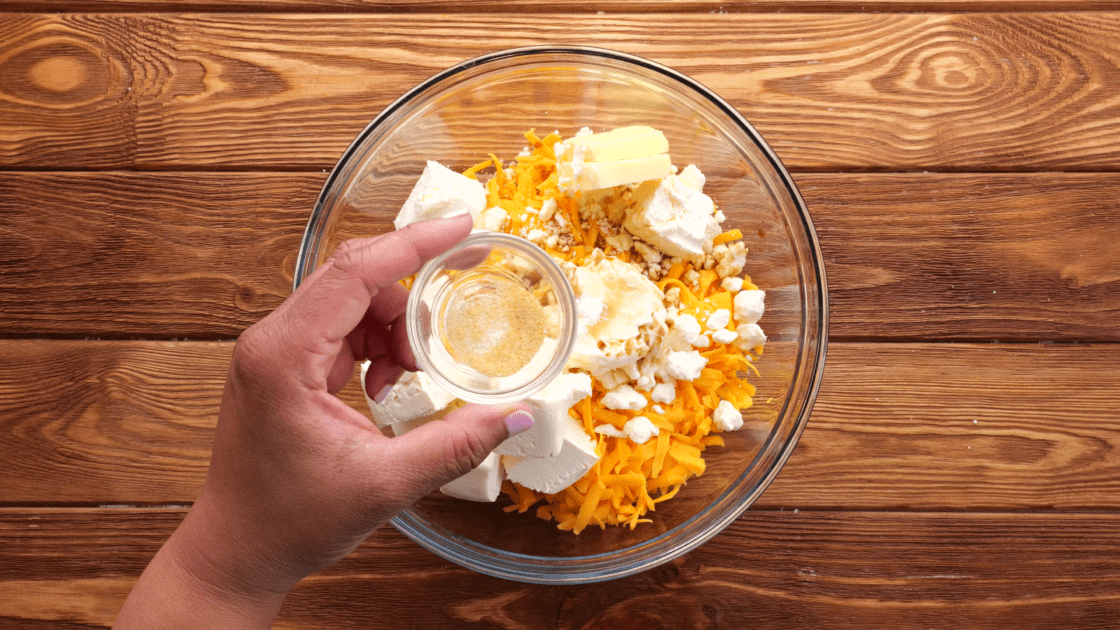 Add garlic powder to mixing bowl.
