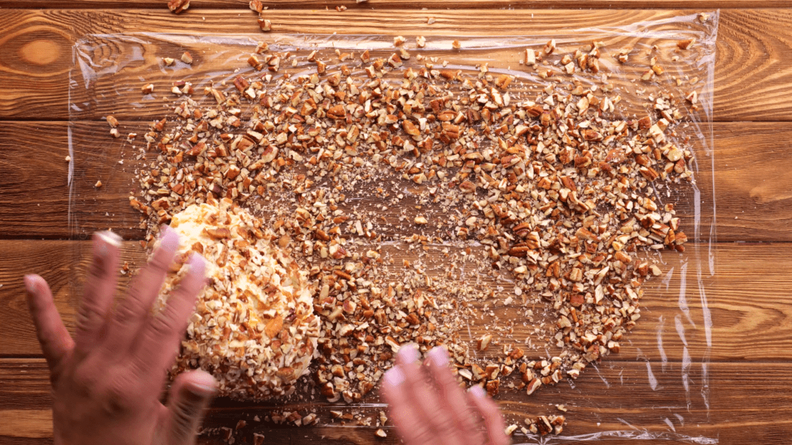 Roll ball into pecans.