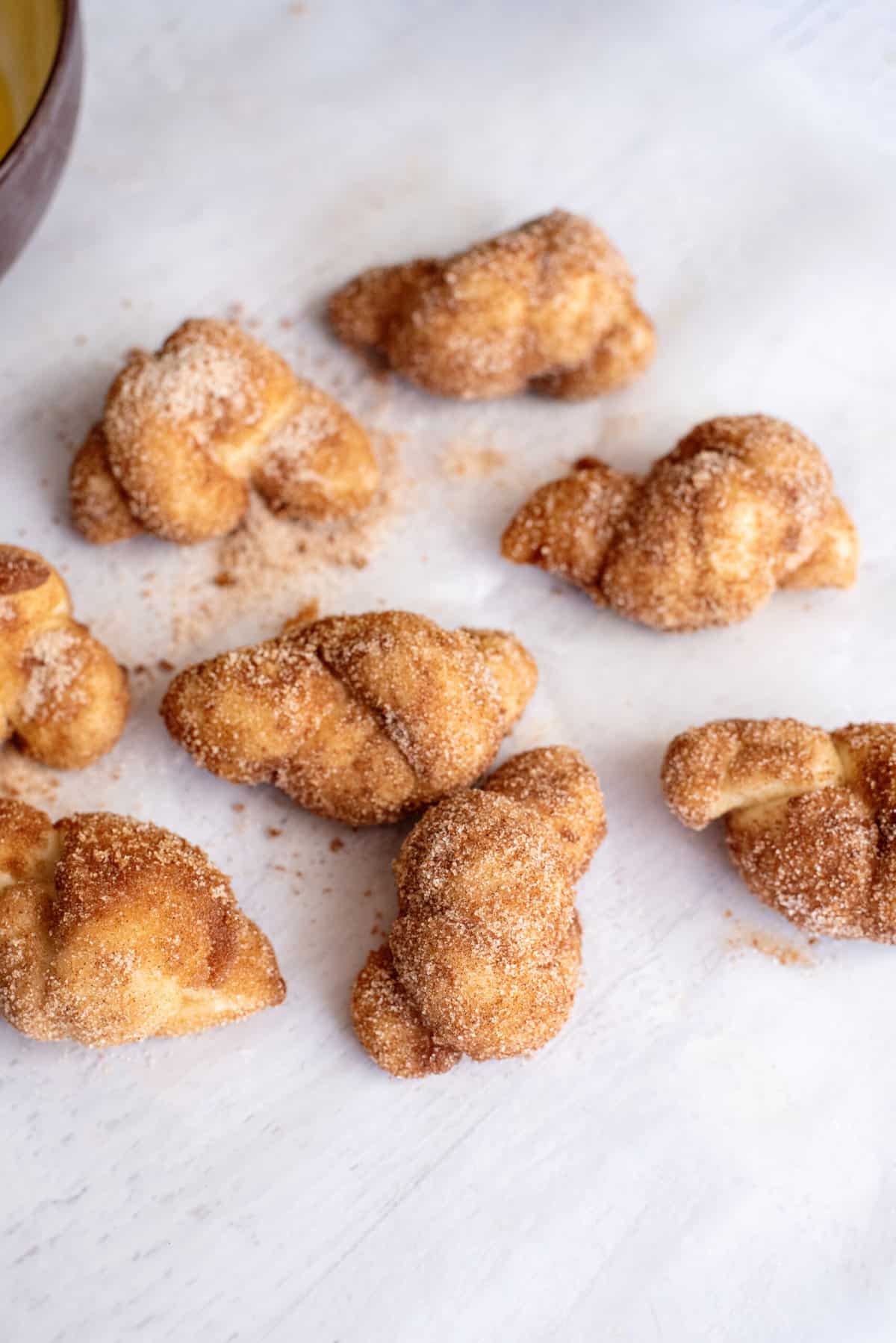 dip all cinnamon knots in butter and cinnamon