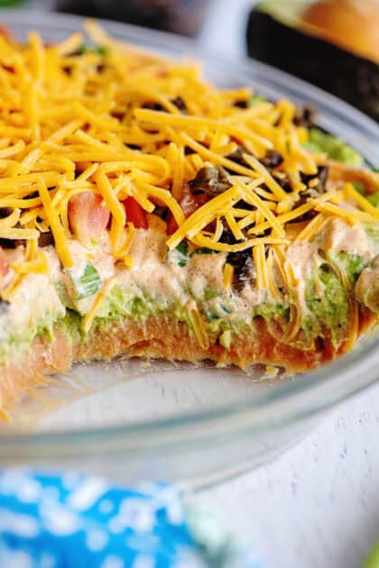 Close up of Tex Mex dip layers in a glass dish.