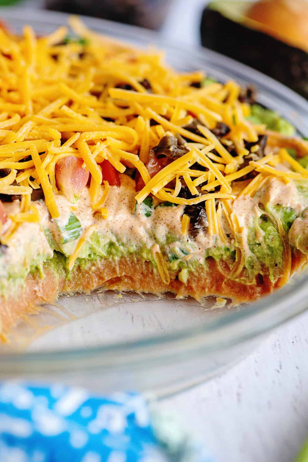 Close up of Tex Mex dip layers in a glass dish.