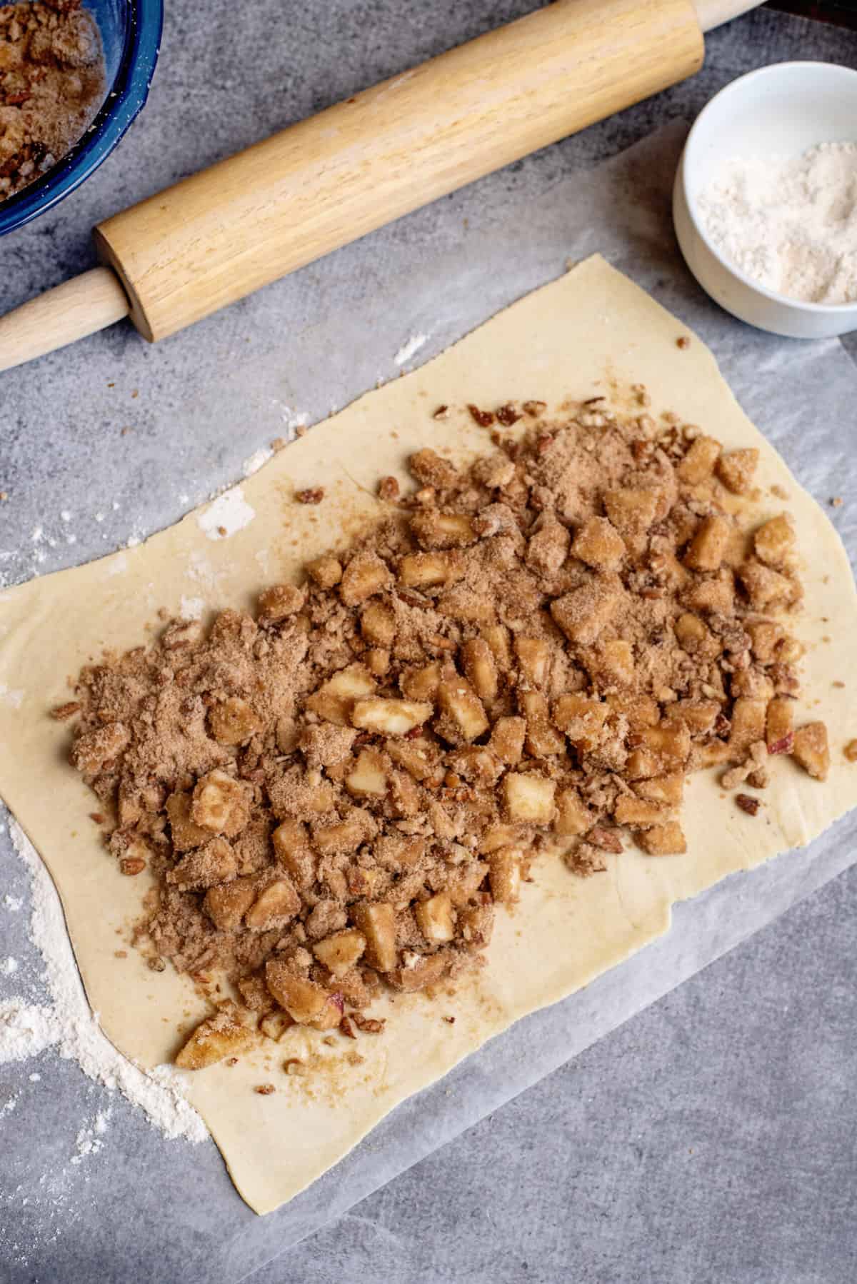 put filling onto puff pastry for apple pinwheels