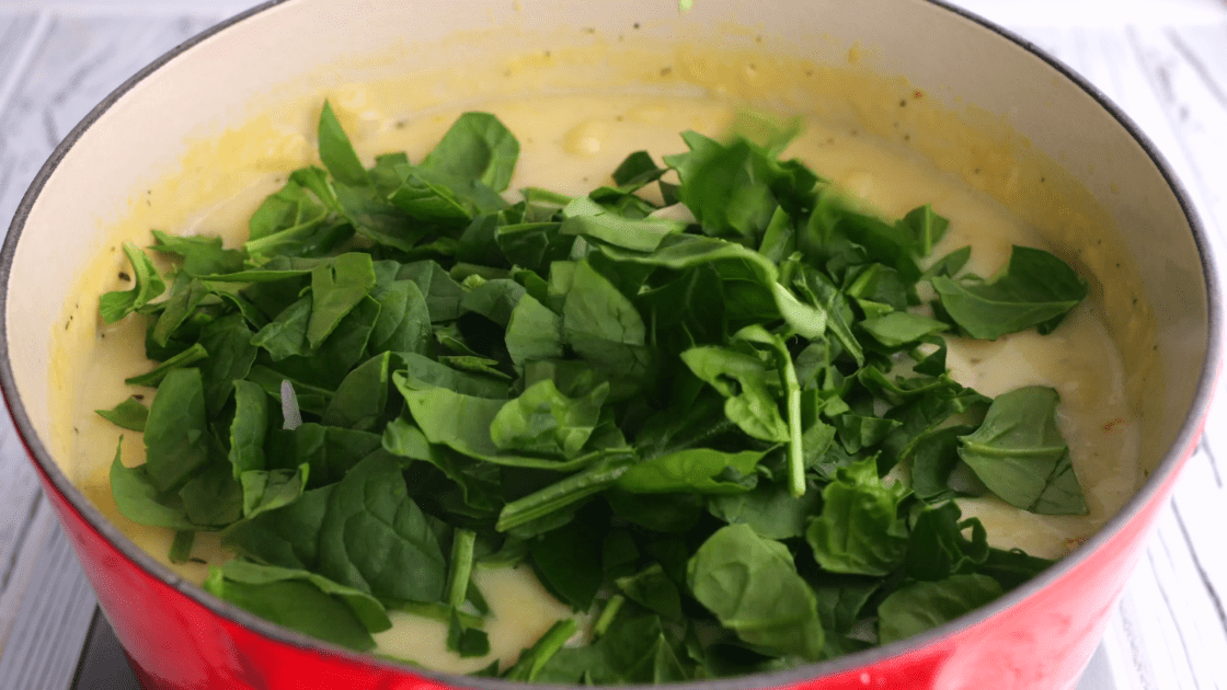 Add fresh spinach to saucepan.