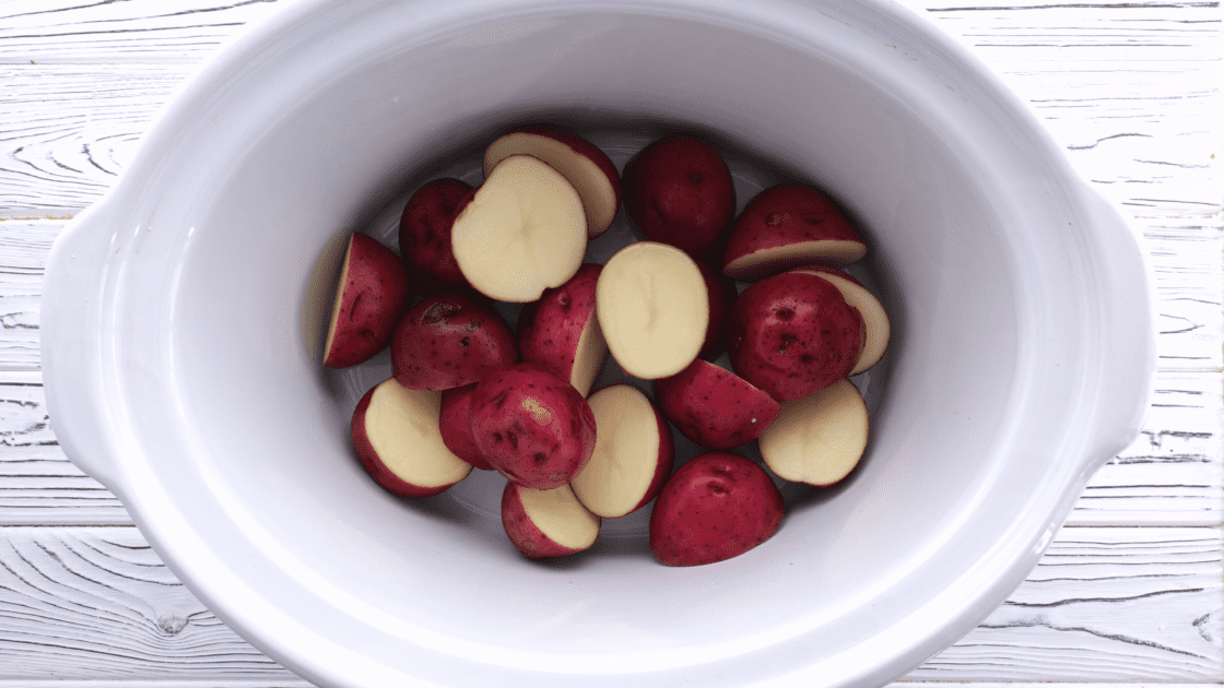 Arrange potatoes in the bottom of the slow cooker.