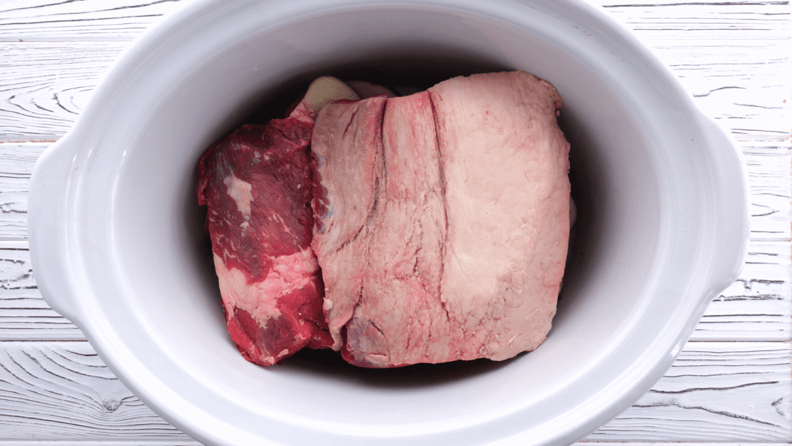 Place corned beef in crock pot, fat side up.