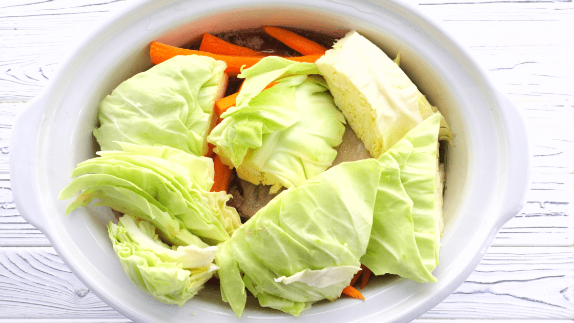 Add cabbage to slow cooker.