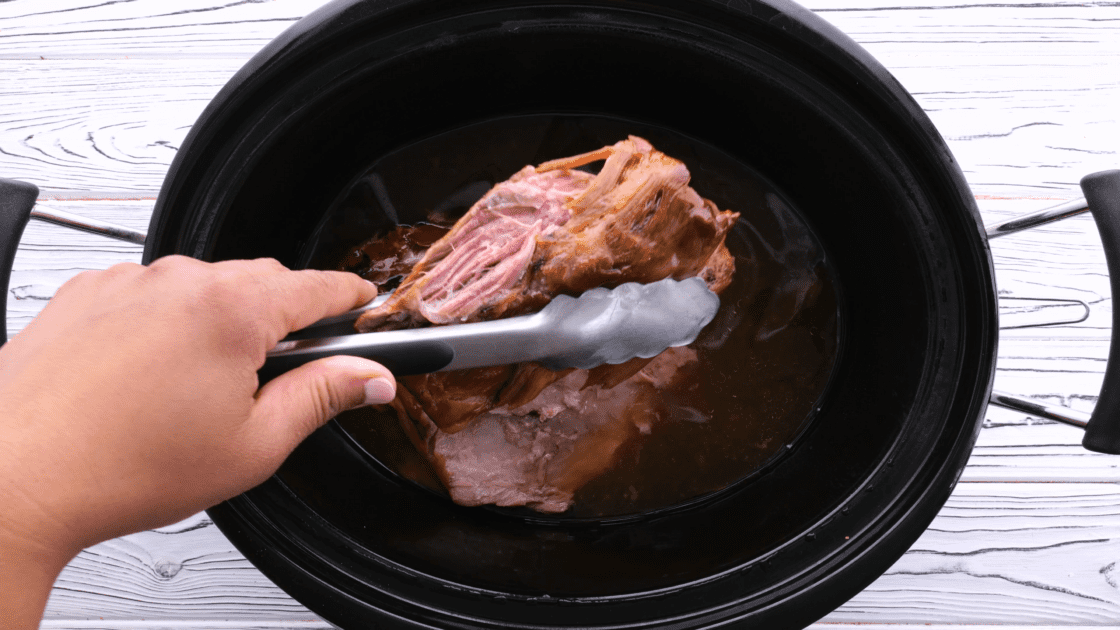 For pulled pork sliders, remove pork roast from crockpot.