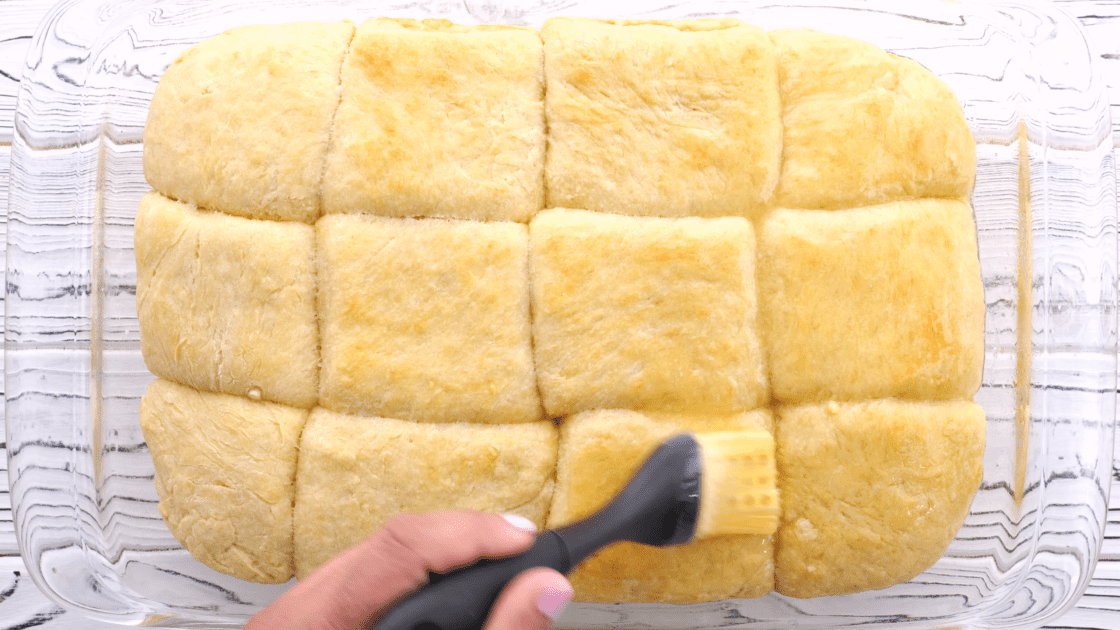 Brush rolls with melted butter before baking.