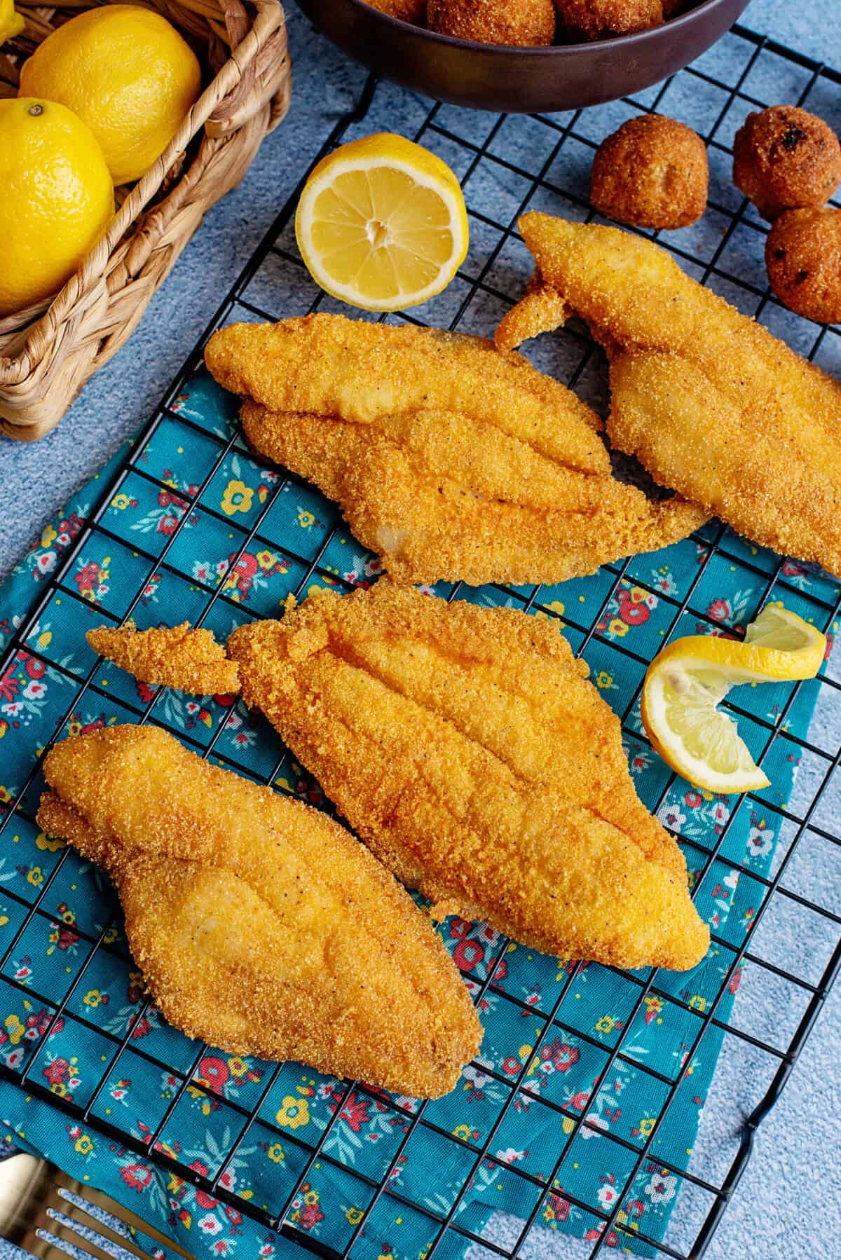 Southern fried catfish fresh out the oven on a oven rack.