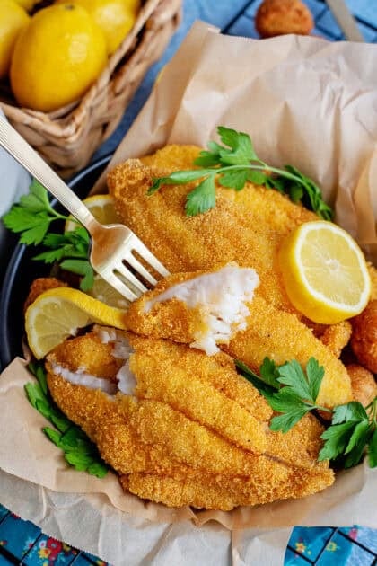 Dipping a fork into delicious Southern fried catfish.