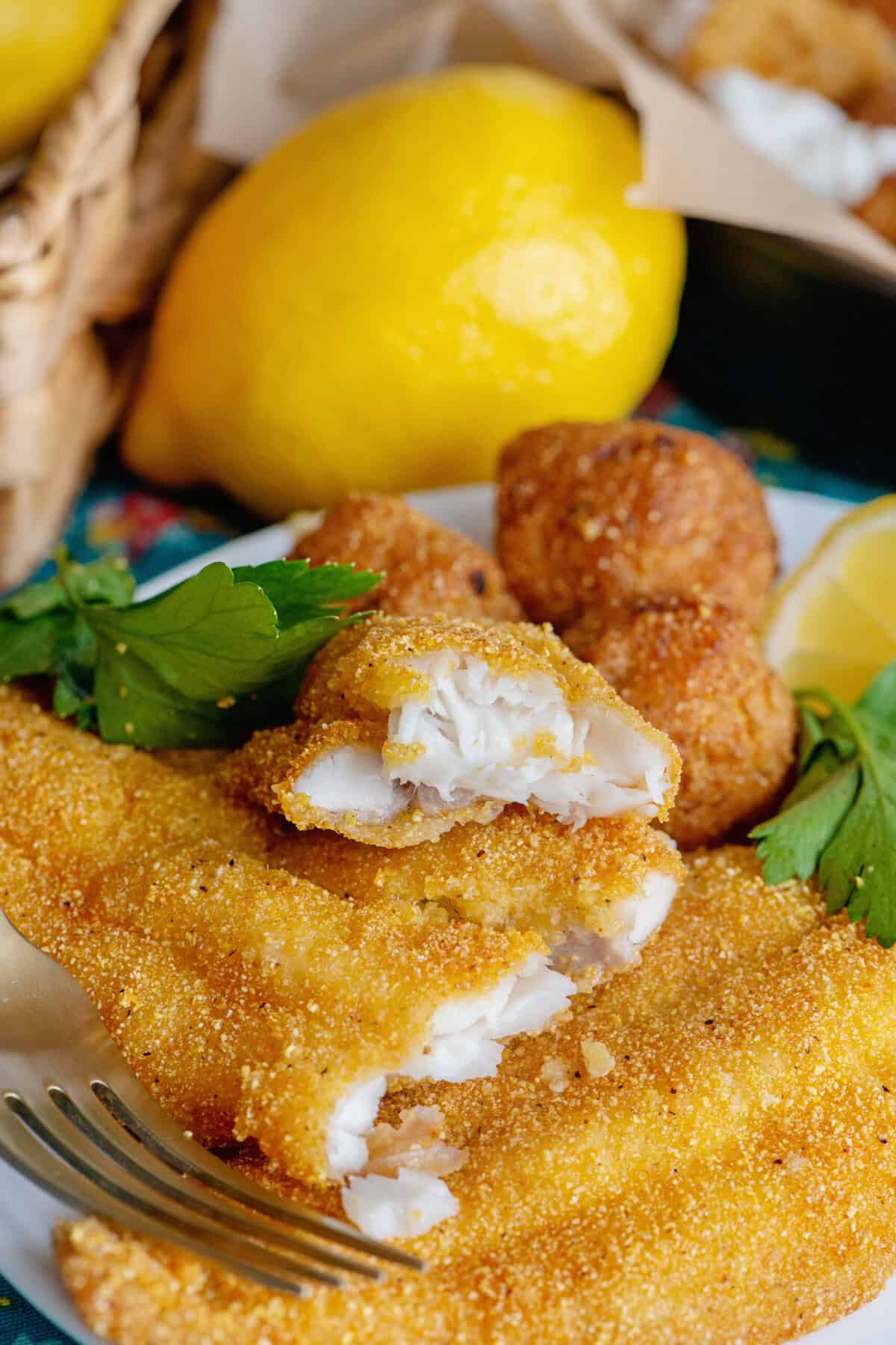 Crispy Southern fried catfish served with parsley and lemon.