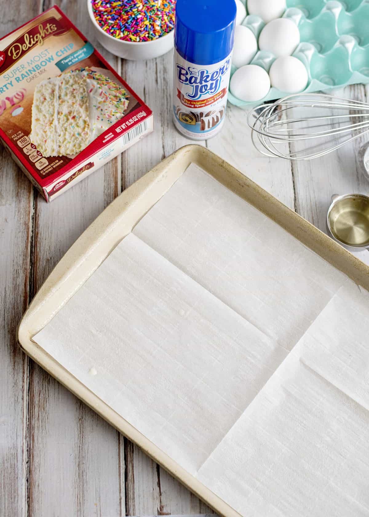 Prepare a jelly roll pan with spray and parchment paper.
