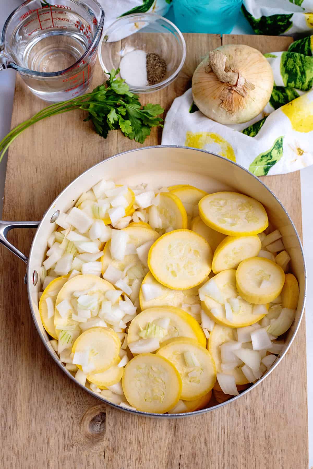 Place onion and squash in skillet.