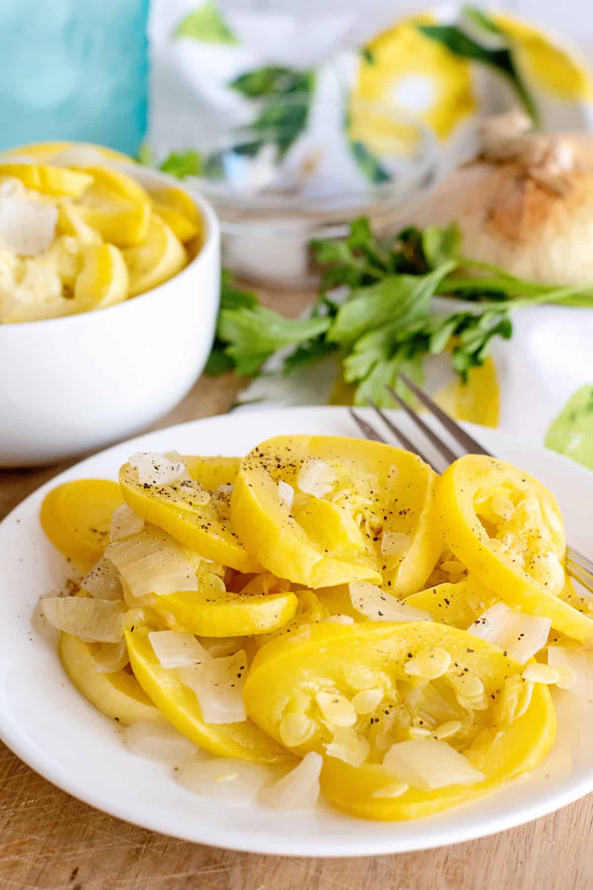 Plate of boiled squash with onions.