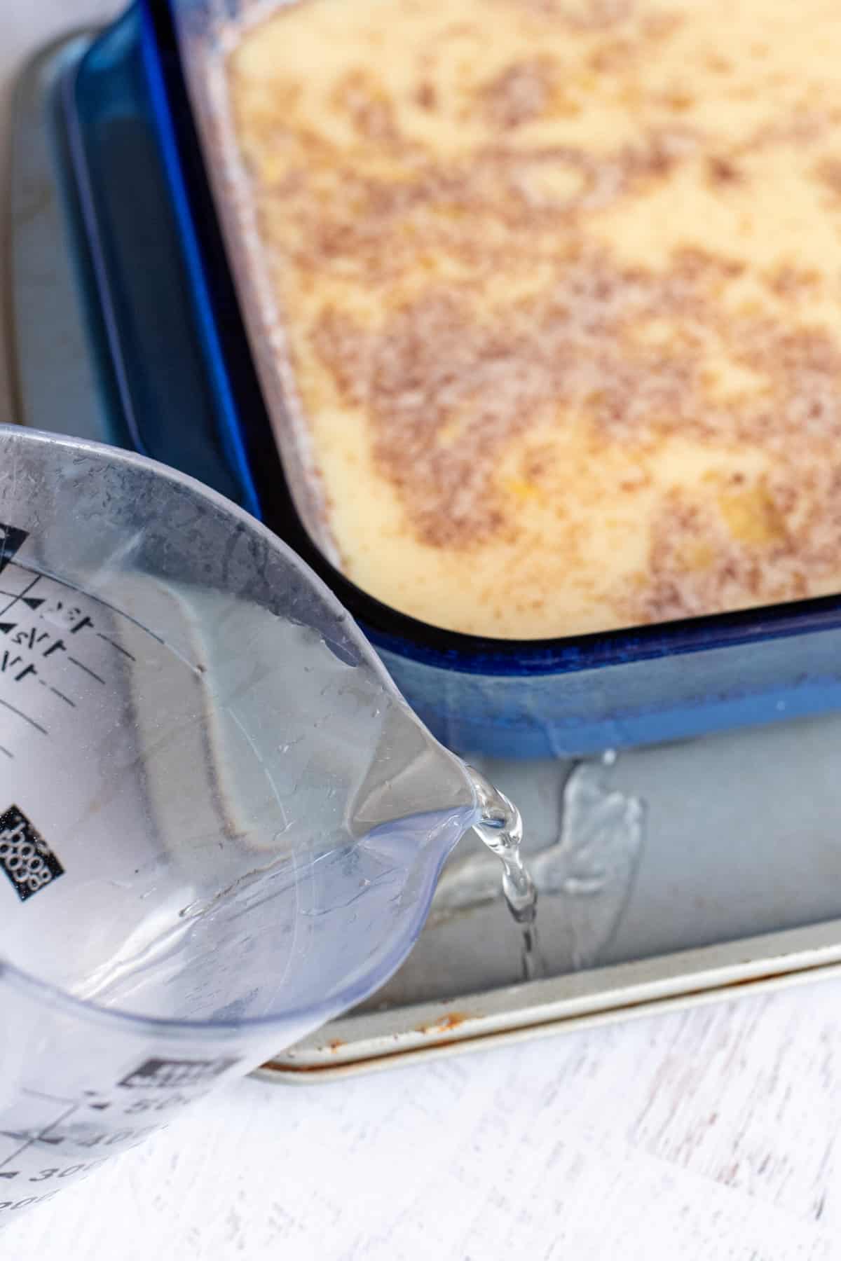 water in the pan underneath the baking dish