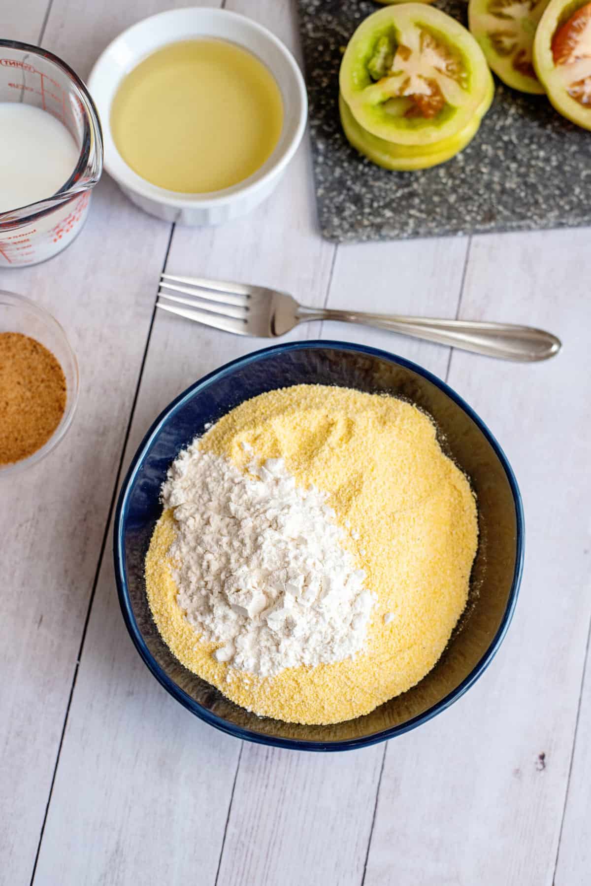 combine flour and cornmeal in a bowl