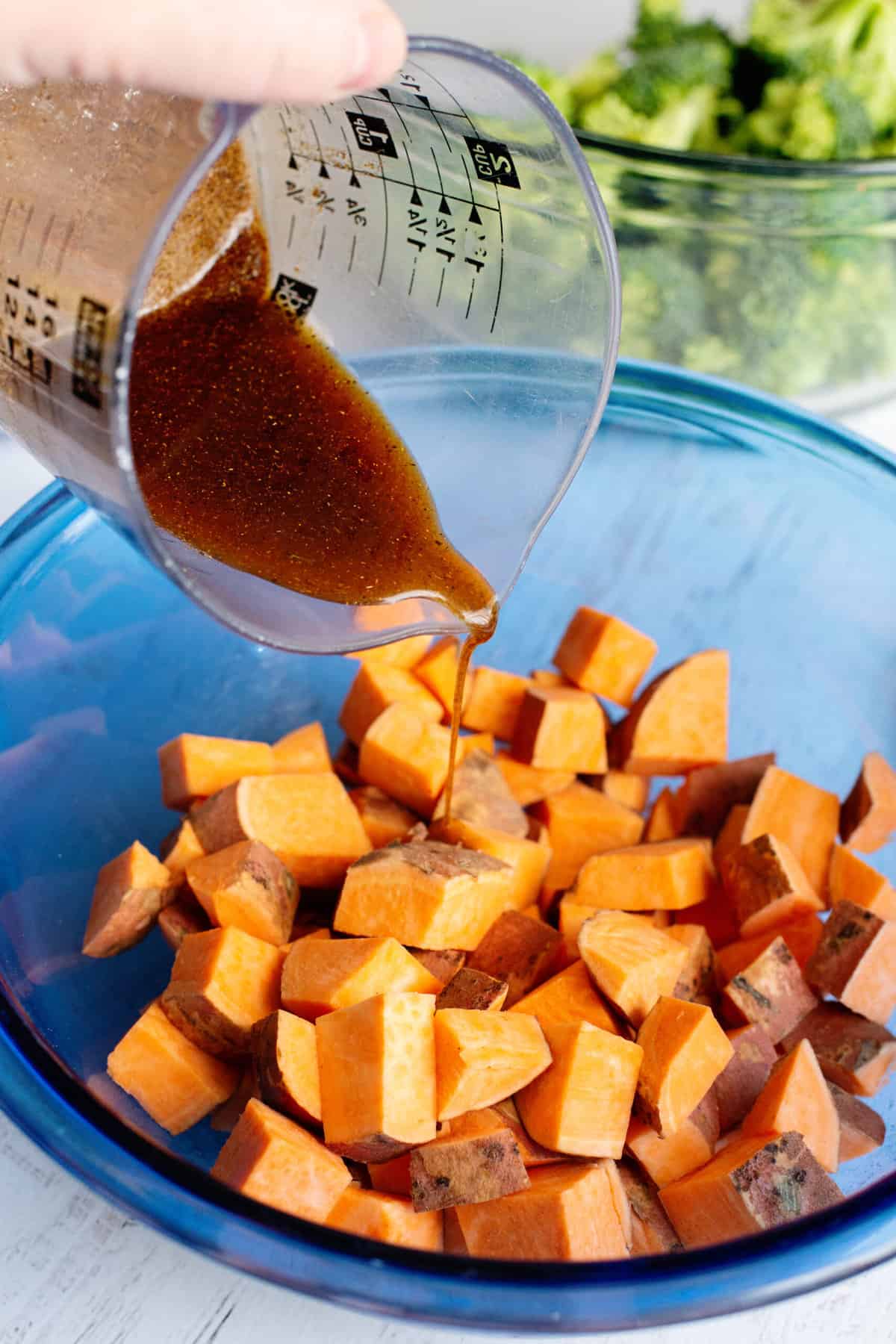coat sweet potatoes with half the whisked mixture