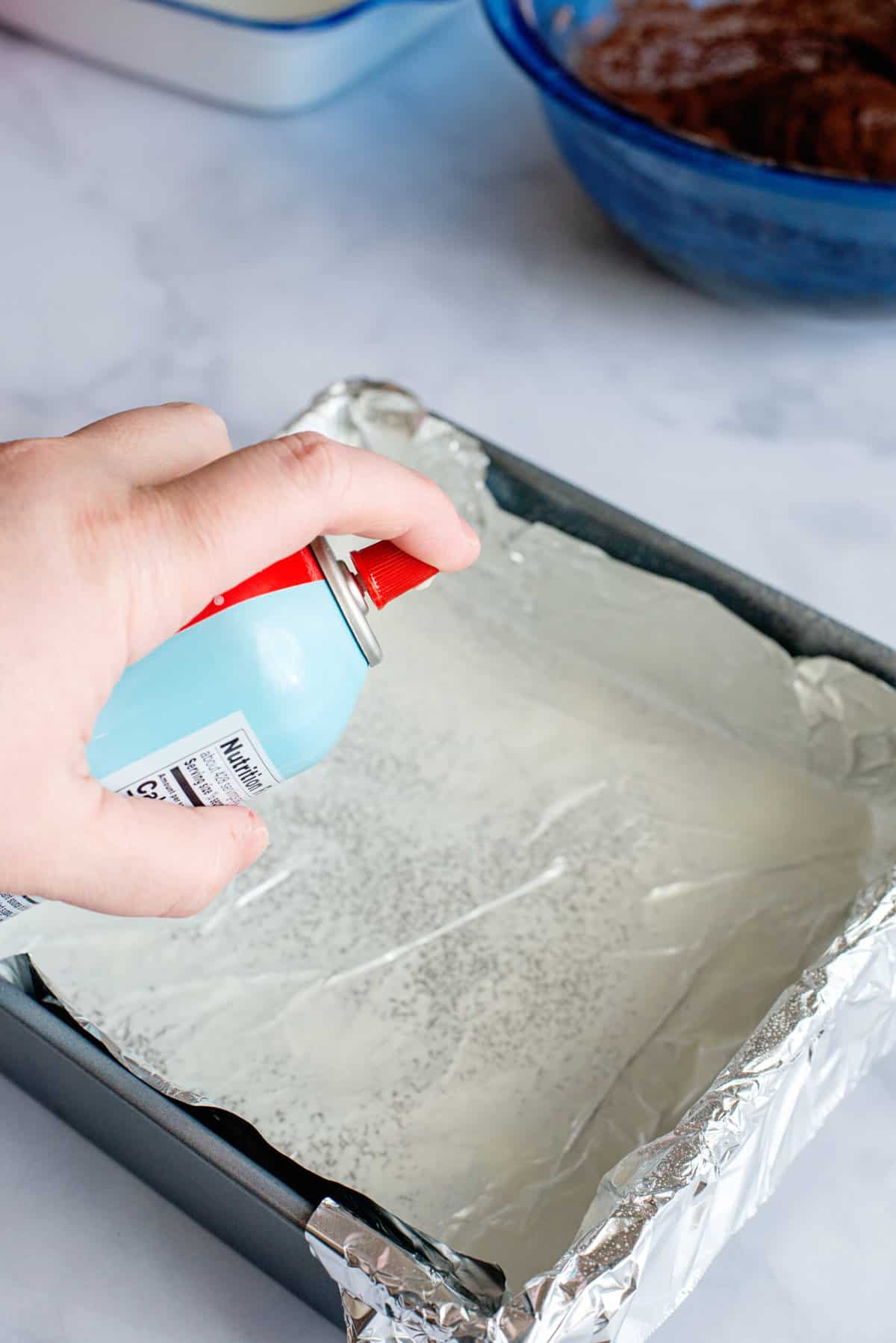 Preheat oven to 350 degrees. Spray an 8x8 baking pan with non-stick baking spray. Optional: For easy removal, line the pan with foil before spraying.