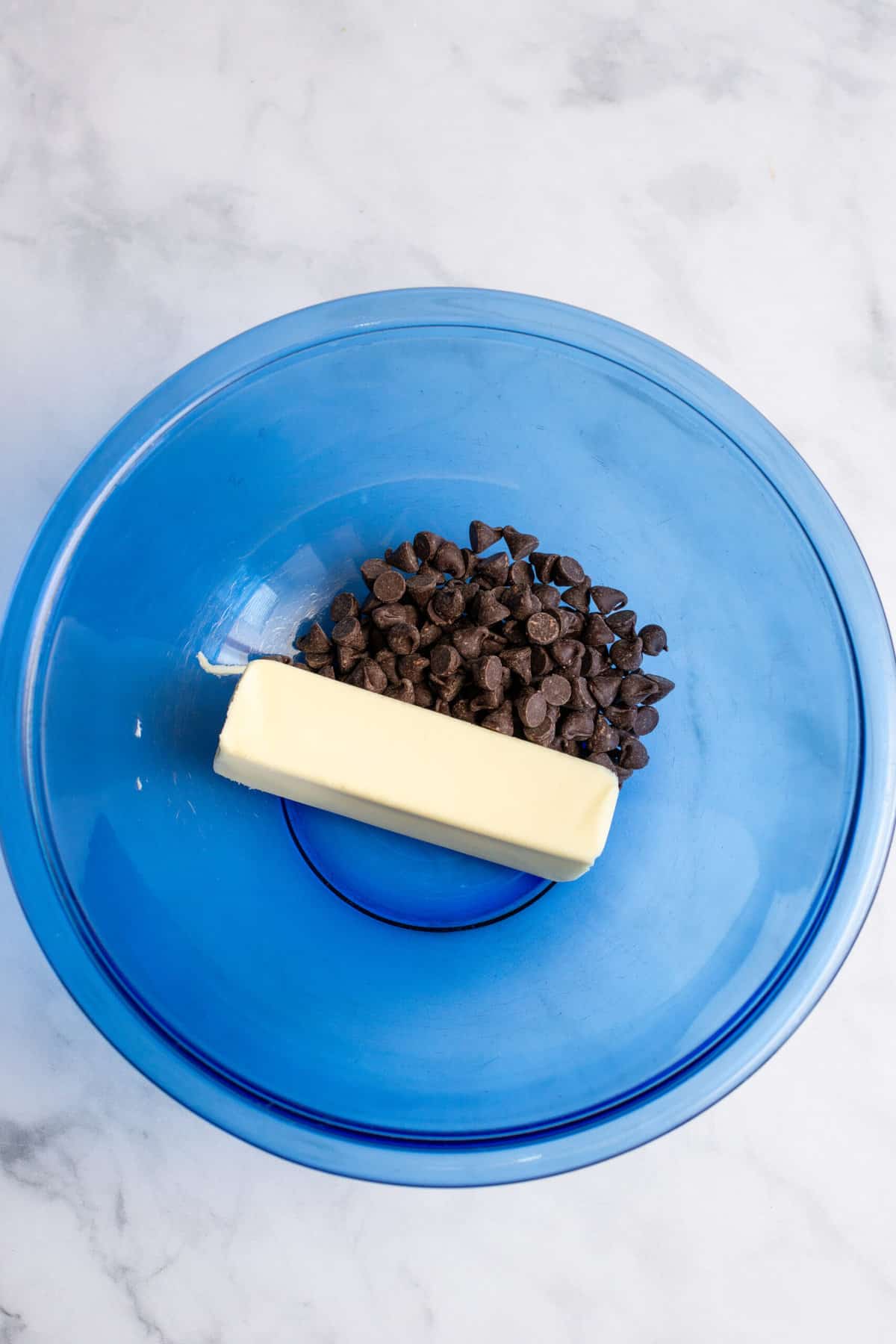 combine butter and chocolate chips in microwaveable bowl