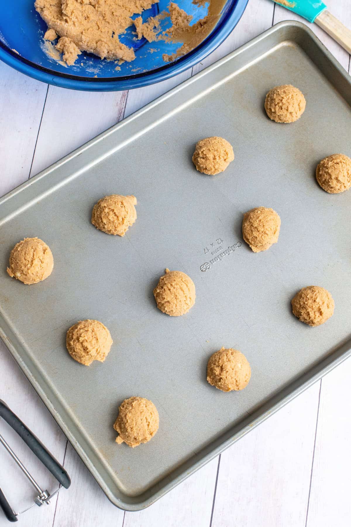 scoop cookies onto cookie sheet