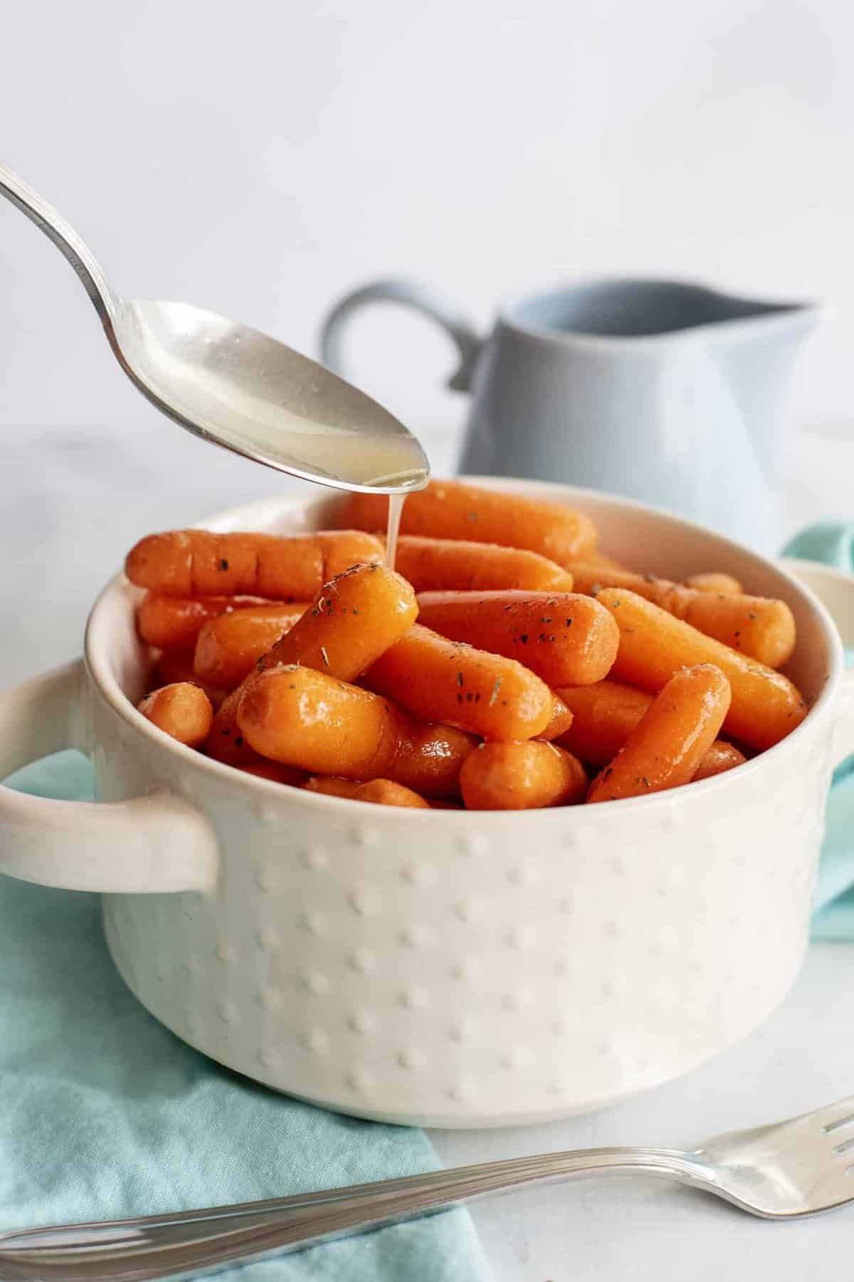 a bowl of candied carrots